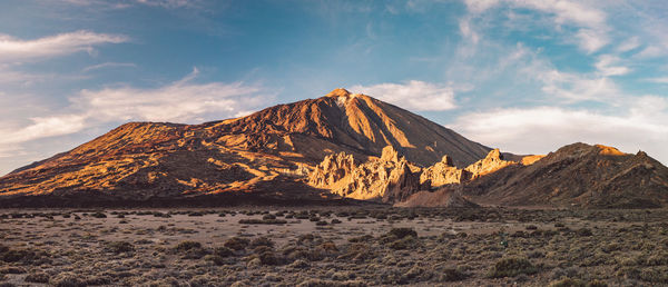 Scenic view of arid landscape against sky