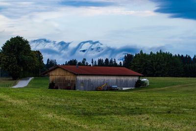 House on field against sky