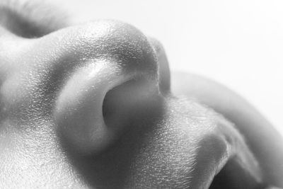 Close-up of human hand against gray background