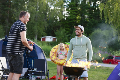 Family having barbecue on campsite
