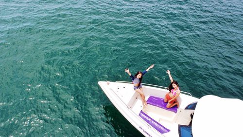 High angle view of people on boat in sea