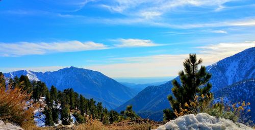 Panoramic view of mountains against blue sky