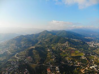 Aerial view of townscape against sky