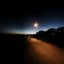 Illuminated street light at night