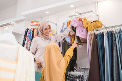 Mother and daughter shopping in mall