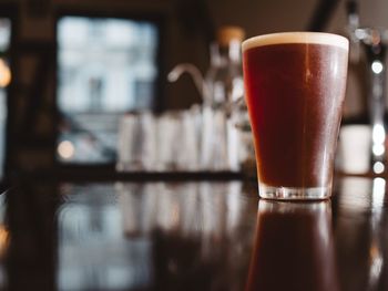 Close-up of beer in glass on table