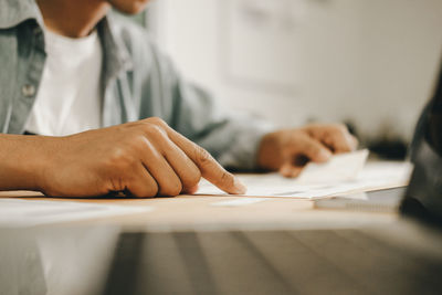 Close-up of man working on table