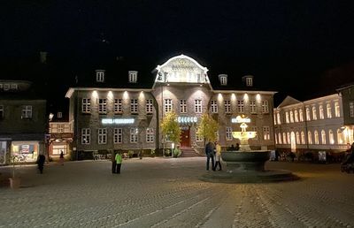 Buildings in city at night