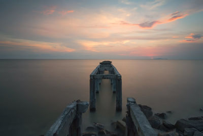 Scenic view of sea against cloudy sky