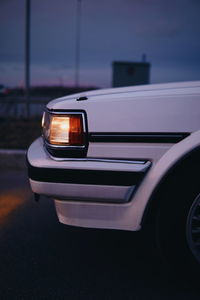 Close-up of car on road