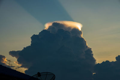 Light in the dark and dramatic storm clouds, sunset sky