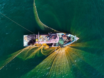 High angle view of ship sailing in sea