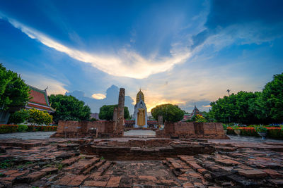 Statue of temple against building