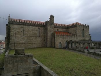 View of historic building against cloudy sky