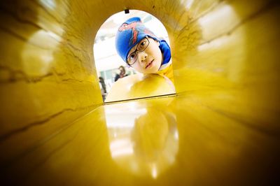 Close-up portrait of boy looking in mailbox