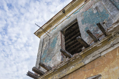 Low angle view of old building against sky