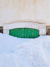 House door covered with snow
