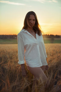 Young woman standing on field