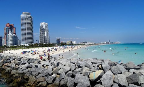 Panoramic view of beach against blue sky