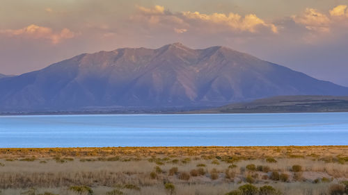 Scenic view of landscape against sky during sunset