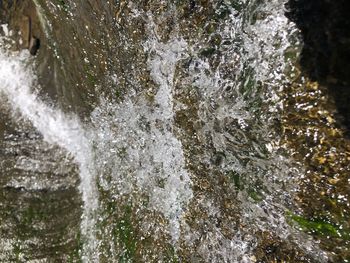 Close-up of water splashing on rocks