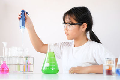 Girl experimenting at laboratory