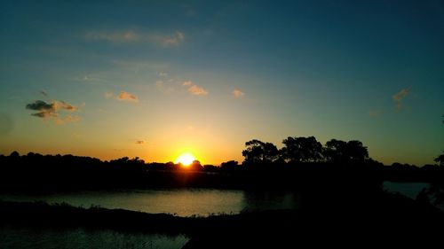 Scenic view of sunset over river