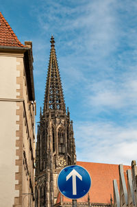 Low angle view of historic cathedral against blue sky