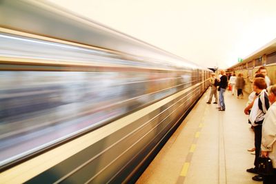 Blurred motion of train at railroad station platform