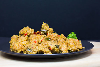 Close-up of meat in plate on table