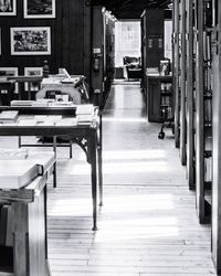 Empty chairs and table in building