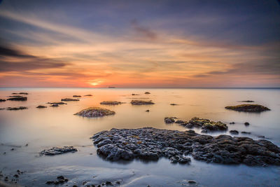 Scenic view of sea against sky during sunset