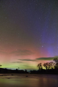 Aurora borealis in ennis montana at burnt tree access on the madison river.