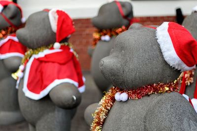 Close-up of santa hat on sculptures