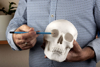 Close-up of man holding ice cream