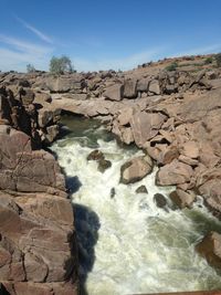 Scenic view of water against clear sky