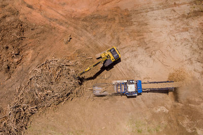 High angle view of abandoned vehicle on field