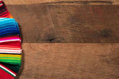 Directly above shot of serape on wooden table