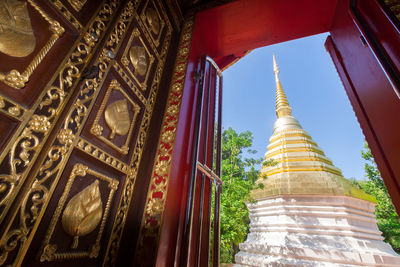 Low angle view of temple against building