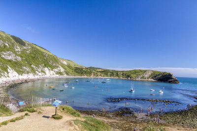 Scenic view of sea against clear blue sky