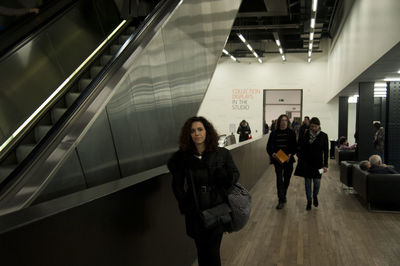 People walking on escalator