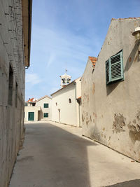 Narrow street leading towards old church st.roko in bibinje,croatia