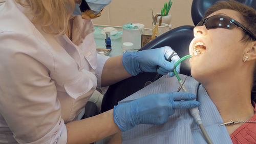 Dentist examining patient