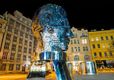 Low angle view of illuminated buildings at night