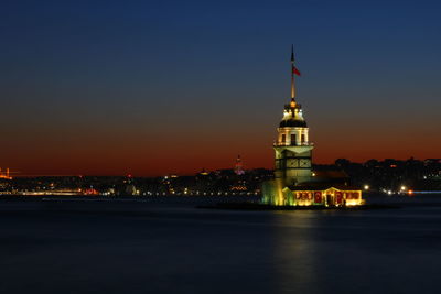 Illuminated building against sky at night