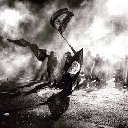 People in traditional clothing against sky