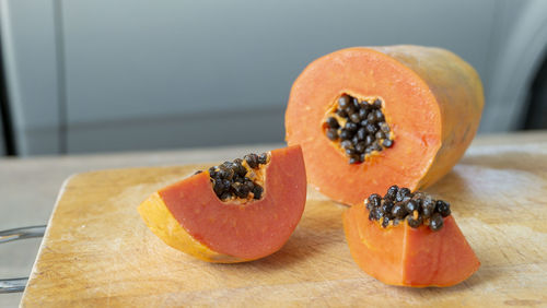 Close-up of orange slice on cutting board