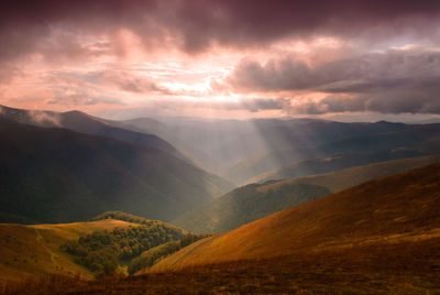Scenic view of mountains against sky during sunset