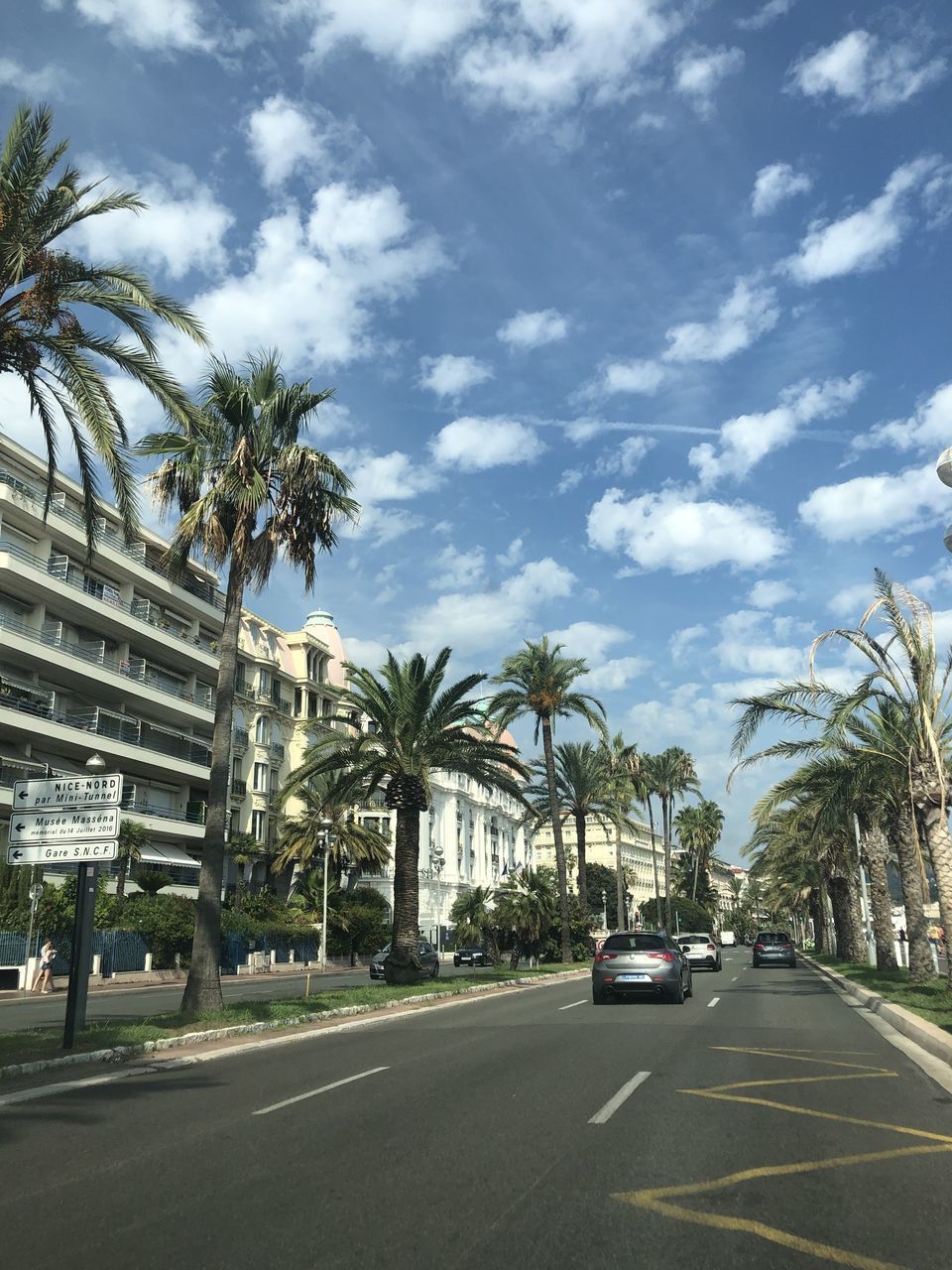 CARS ON ROAD IN CITY