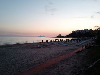 Scenic view of beach against sky during sunset